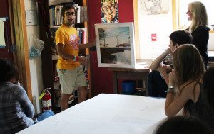 Will Melnick '10 shows Kerlin Conyngham's Photo II class a book of his images produced during his college years. 