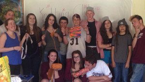 Founding Knitting Club members Zoe Neeley '13 (far left) and Kellie Rainville '13 (second from left) visiting current knitters this spring. 